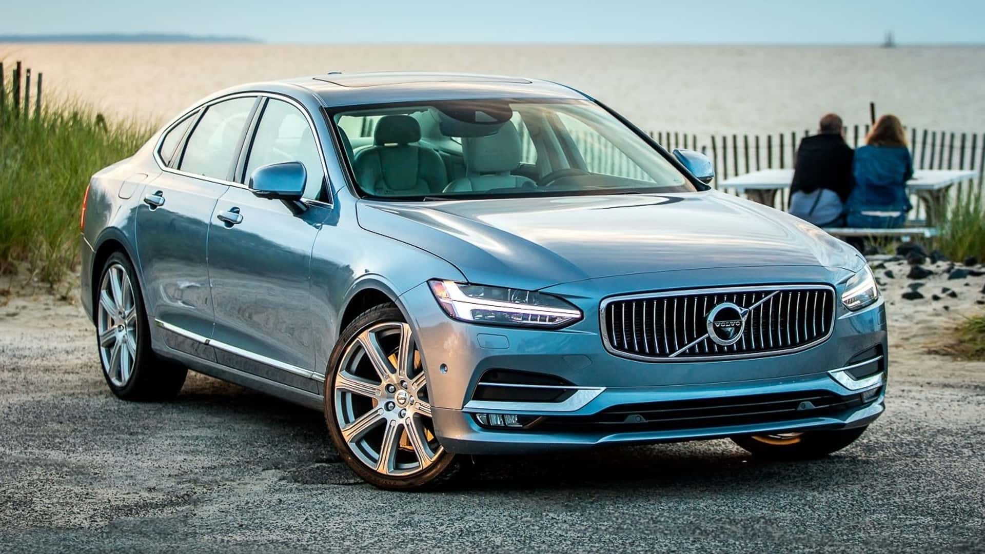 Volvo S90 sedan in front of a beach exterior